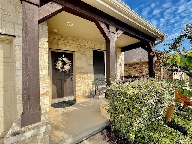 doorway to property featuring a garage