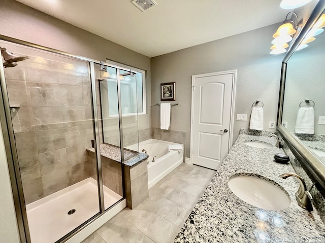 bathroom featuring vanity and separate shower and tub