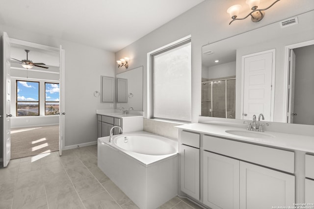 bathroom featuring tile patterned flooring, shower with separate bathtub, vanity, and ceiling fan