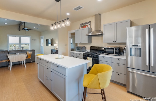 kitchen featuring wall chimney range hood, stainless steel fridge with ice dispenser, black gas stove, vaulted ceiling with beams, and light hardwood / wood-style flooring