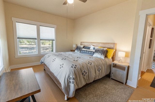 bedroom featuring light wood-type flooring and ceiling fan