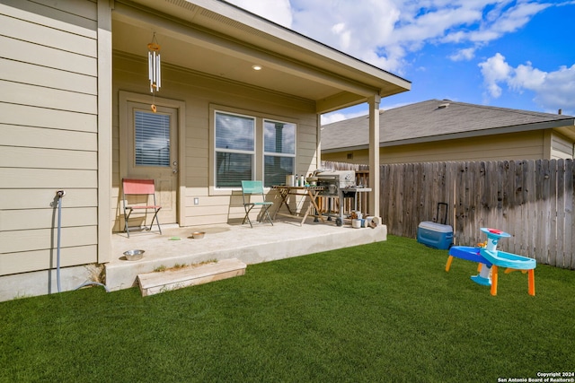 exterior space with a patio and a yard