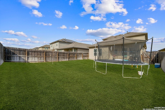 view of yard with a trampoline