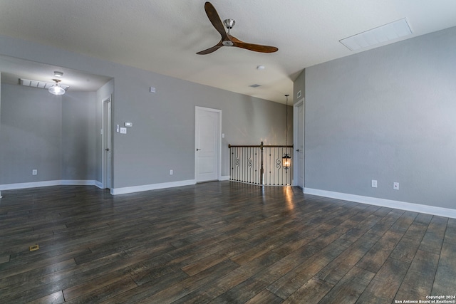 unfurnished living room with ceiling fan and dark hardwood / wood-style floors