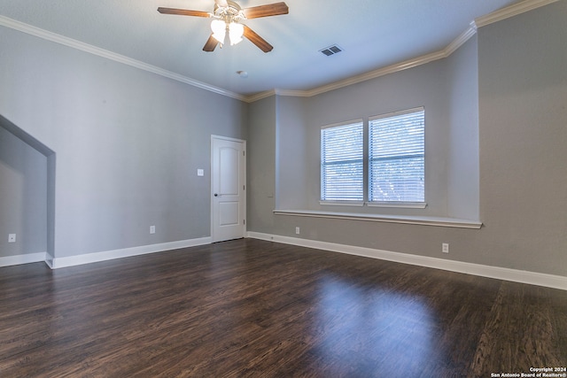 empty room featuring ornamental molding, ceiling fan, and dark hardwood / wood-style flooring