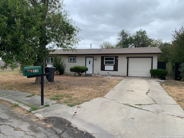 single story home featuring a garage