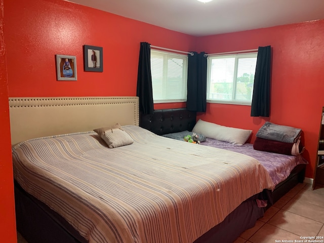 bedroom featuring light tile patterned floors