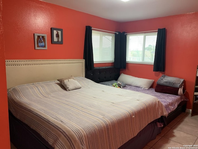 bedroom featuring tile patterned floors
