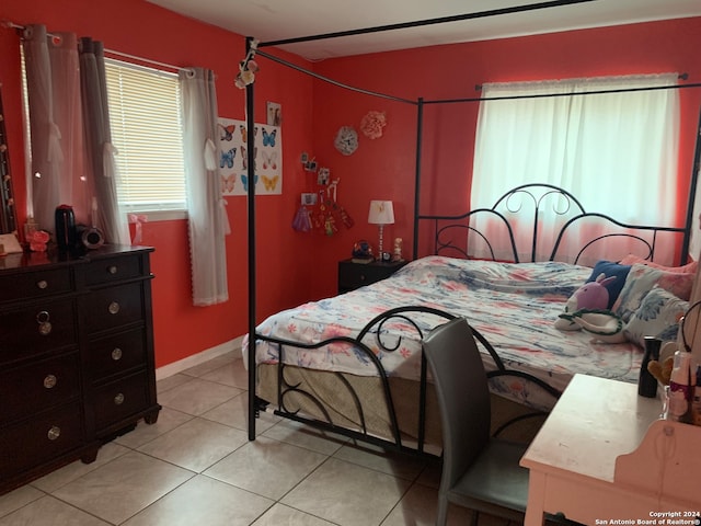 bedroom featuring light tile patterned floors