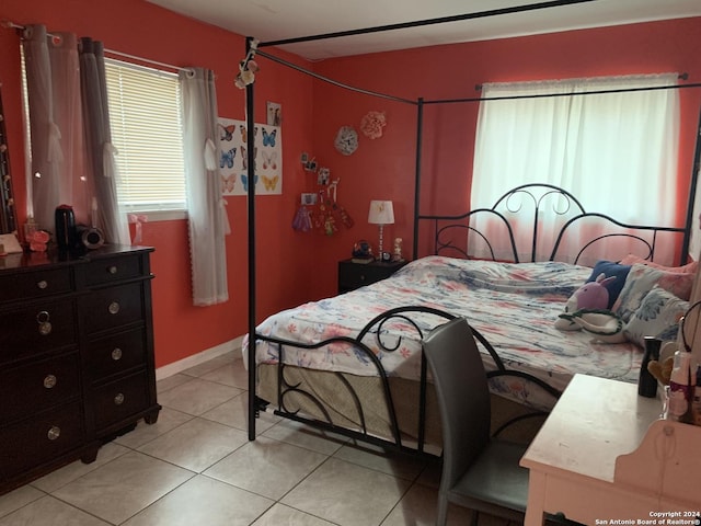 bedroom featuring light tile patterned flooring