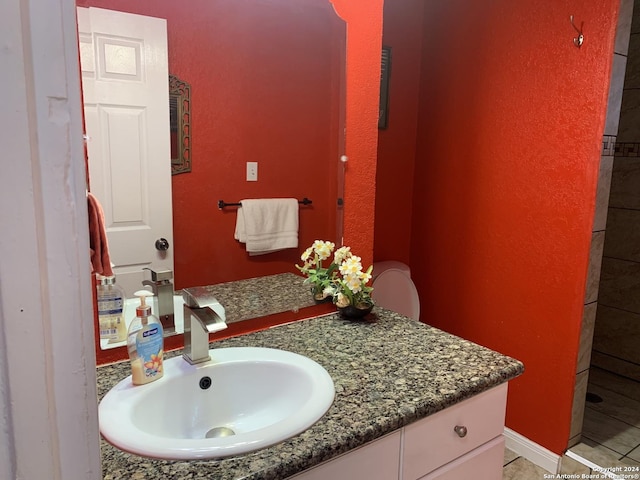 bathroom featuring tile patterned floors and vanity