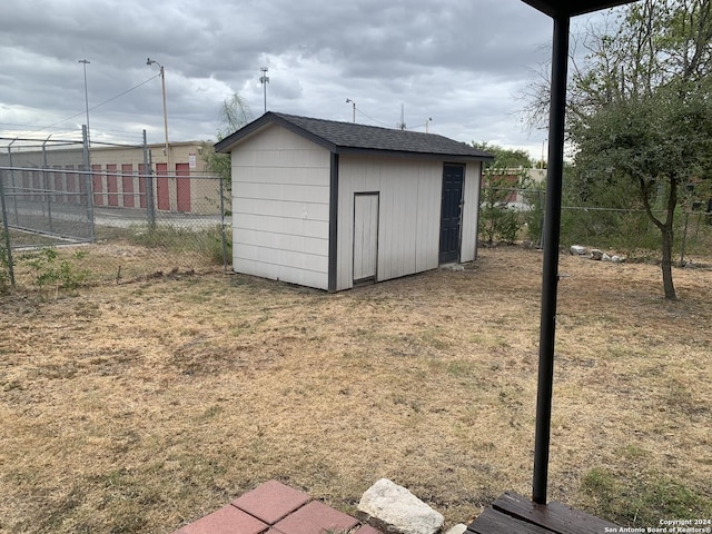 view of shed with fence