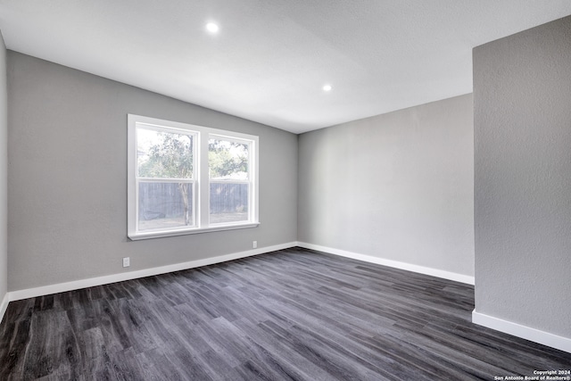 empty room featuring dark hardwood / wood-style floors