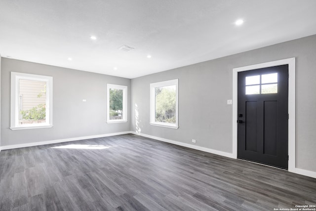 entryway with dark hardwood / wood-style floors