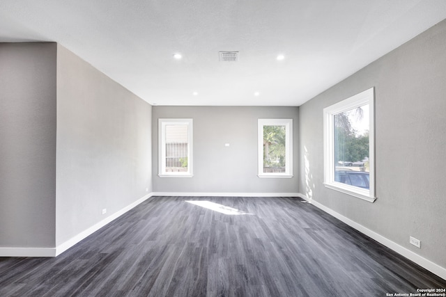 unfurnished room featuring dark hardwood / wood-style floors