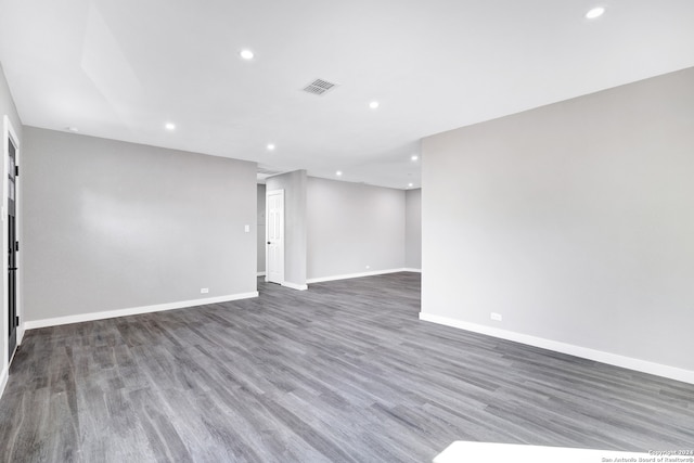 spare room featuring dark hardwood / wood-style floors