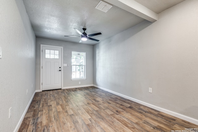 entrance foyer with ceiling fan, hardwood / wood-style flooring, and a textured ceiling