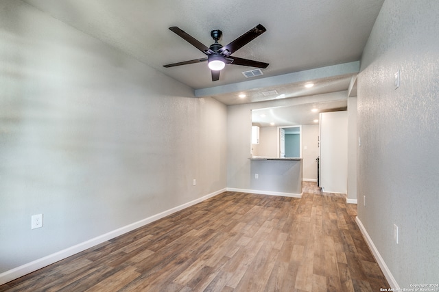 unfurnished room featuring hardwood / wood-style floors and ceiling fan