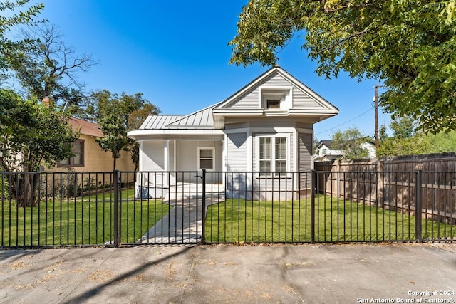 bungalow-style home featuring a front yard