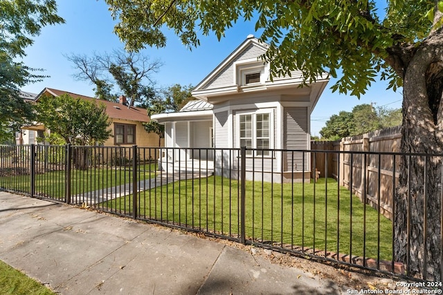 bungalow-style house featuring a front yard