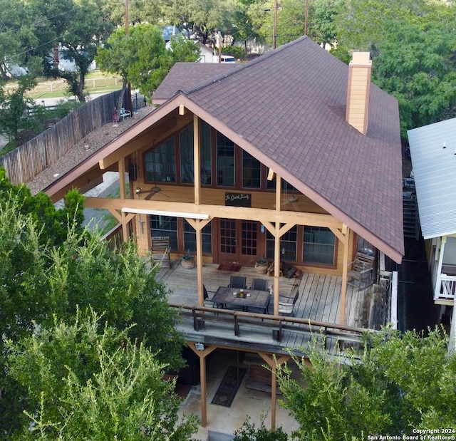 rear view of house featuring a deck