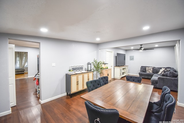 dining space with ceiling fan and dark hardwood / wood-style floors