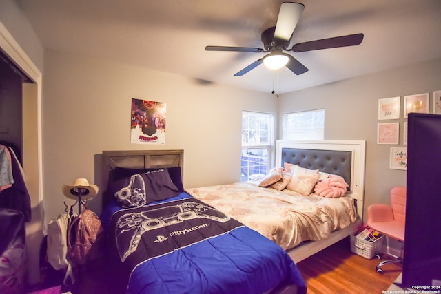 bedroom with hardwood / wood-style flooring and ceiling fan