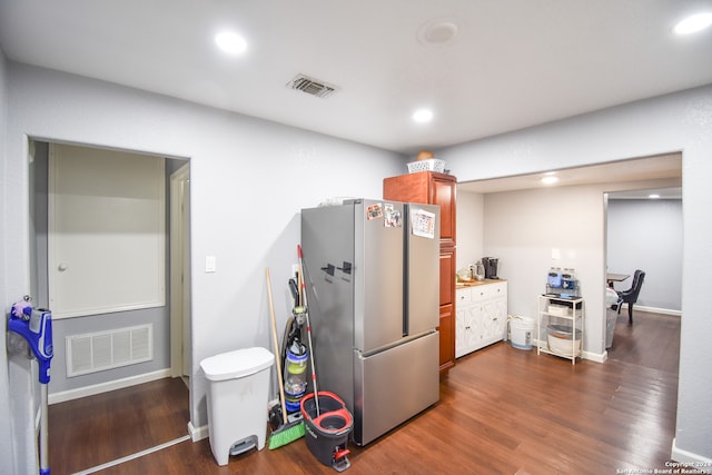 kitchen featuring stainless steel refrigerator and dark hardwood / wood-style floors