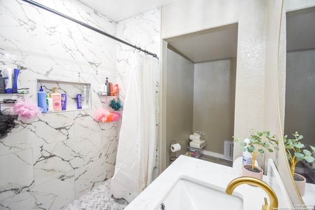 bathroom with vanity and walk in shower