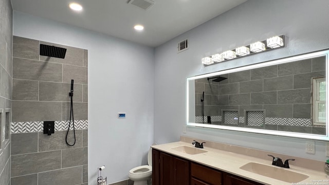 full bathroom featuring visible vents, a walk in shower, and a sink