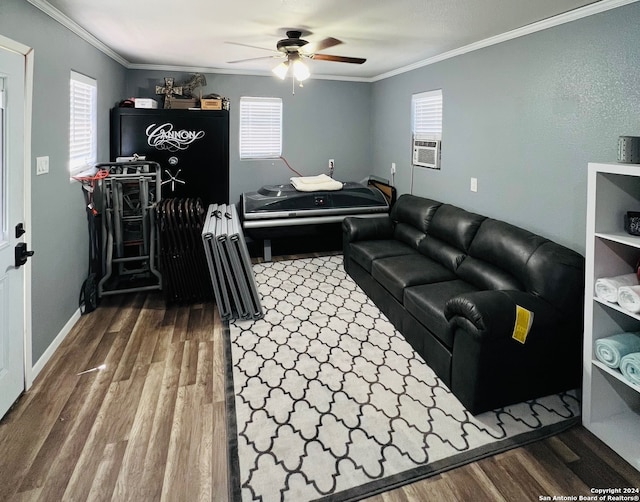 living area with a ceiling fan, wood finished floors, and ornamental molding