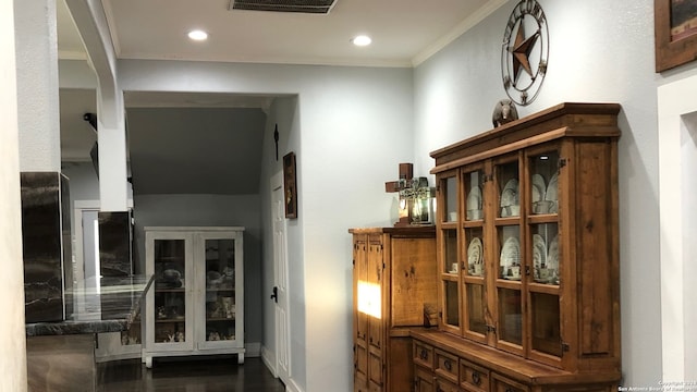 hallway with crown molding and dark wood-type flooring