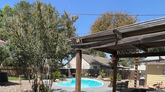 view of swimming pool with a patio area, a fenced in pool, a pergola, and a fenced backyard