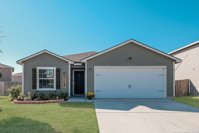 ranch-style house with a garage and a front lawn