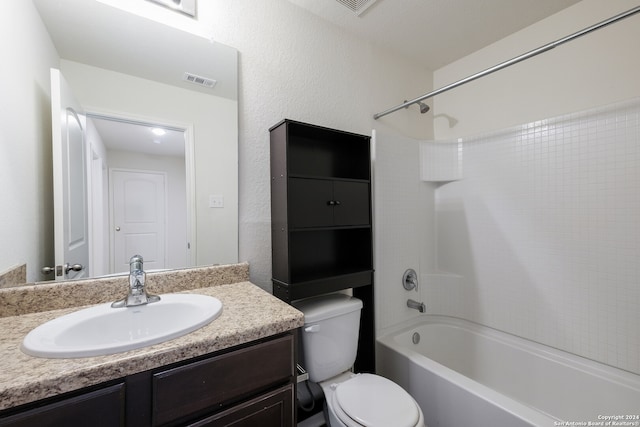 full bathroom featuring toilet, vanity, and tub / shower combination