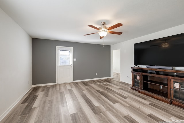 unfurnished living room with light hardwood / wood-style floors and ceiling fan