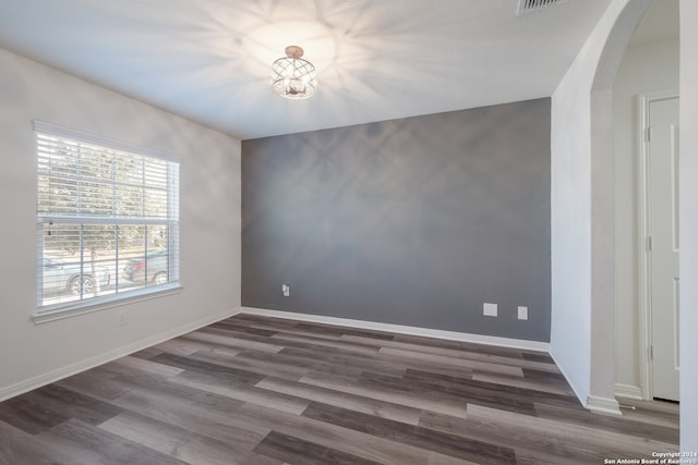 spare room featuring dark hardwood / wood-style floors