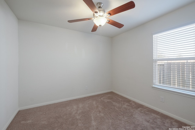 carpeted empty room with ceiling fan