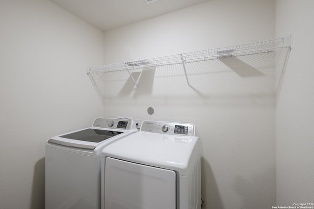 washroom with washer and clothes dryer