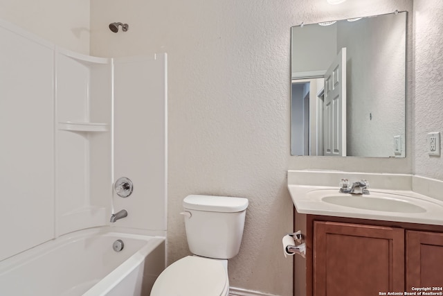 full bathroom with vanity,  shower combination, and toilet