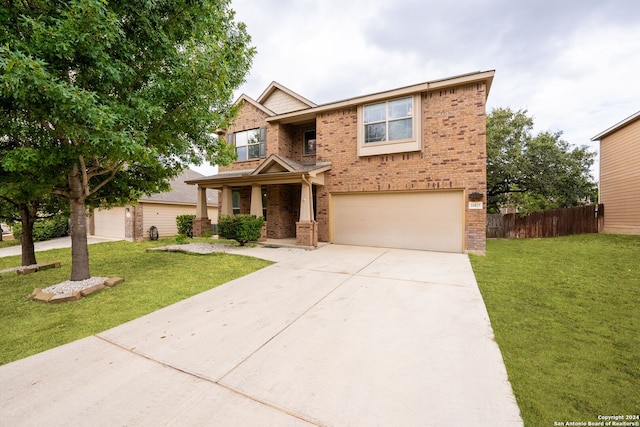 craftsman-style home featuring a front lawn and a garage