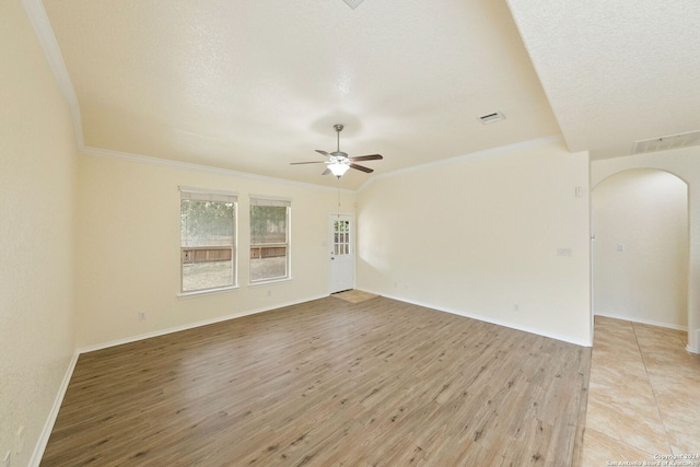 empty room with crown molding, a textured ceiling, light hardwood / wood-style floors, and ceiling fan