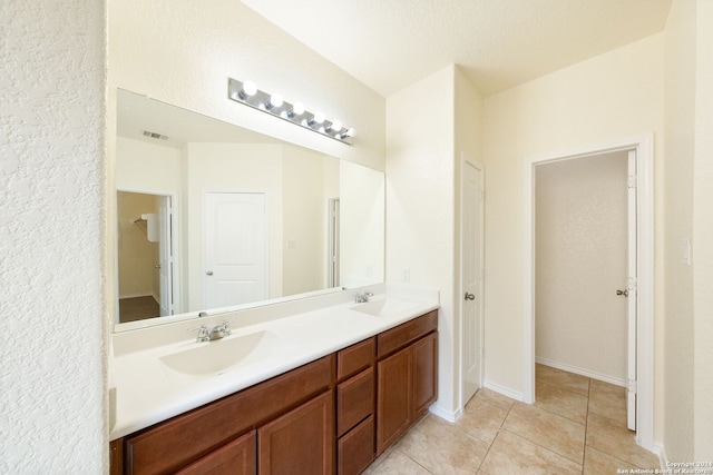 bathroom with vanity and tile patterned floors