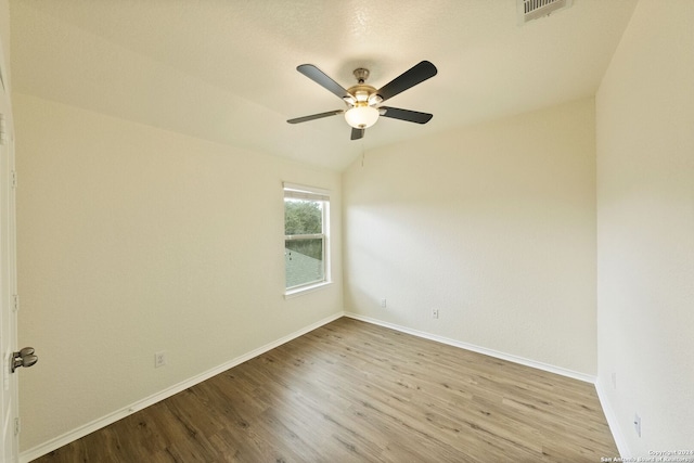 empty room with light wood-type flooring and ceiling fan