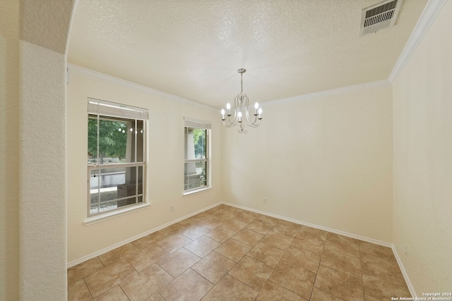 spare room with crown molding, a notable chandelier, and a textured ceiling