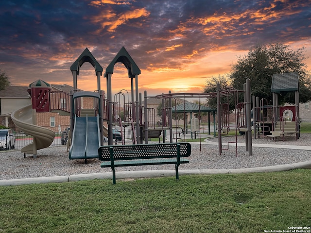 playground at dusk with a yard