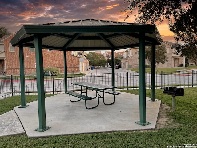 surrounding community featuring a gazebo and a lawn