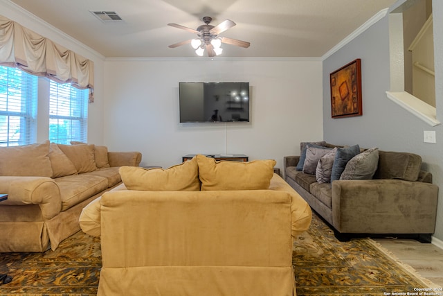 living room featuring crown molding, wood-type flooring, and ceiling fan