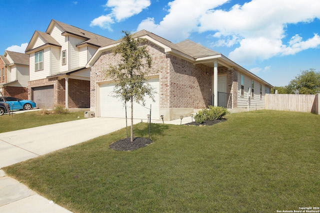 view of front facade featuring a front lawn and a garage