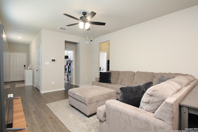 living room with hardwood / wood-style flooring and ceiling fan